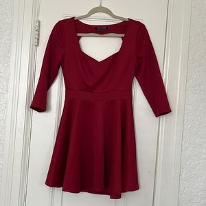 Red Love Culture Flare dress with heart cut out details